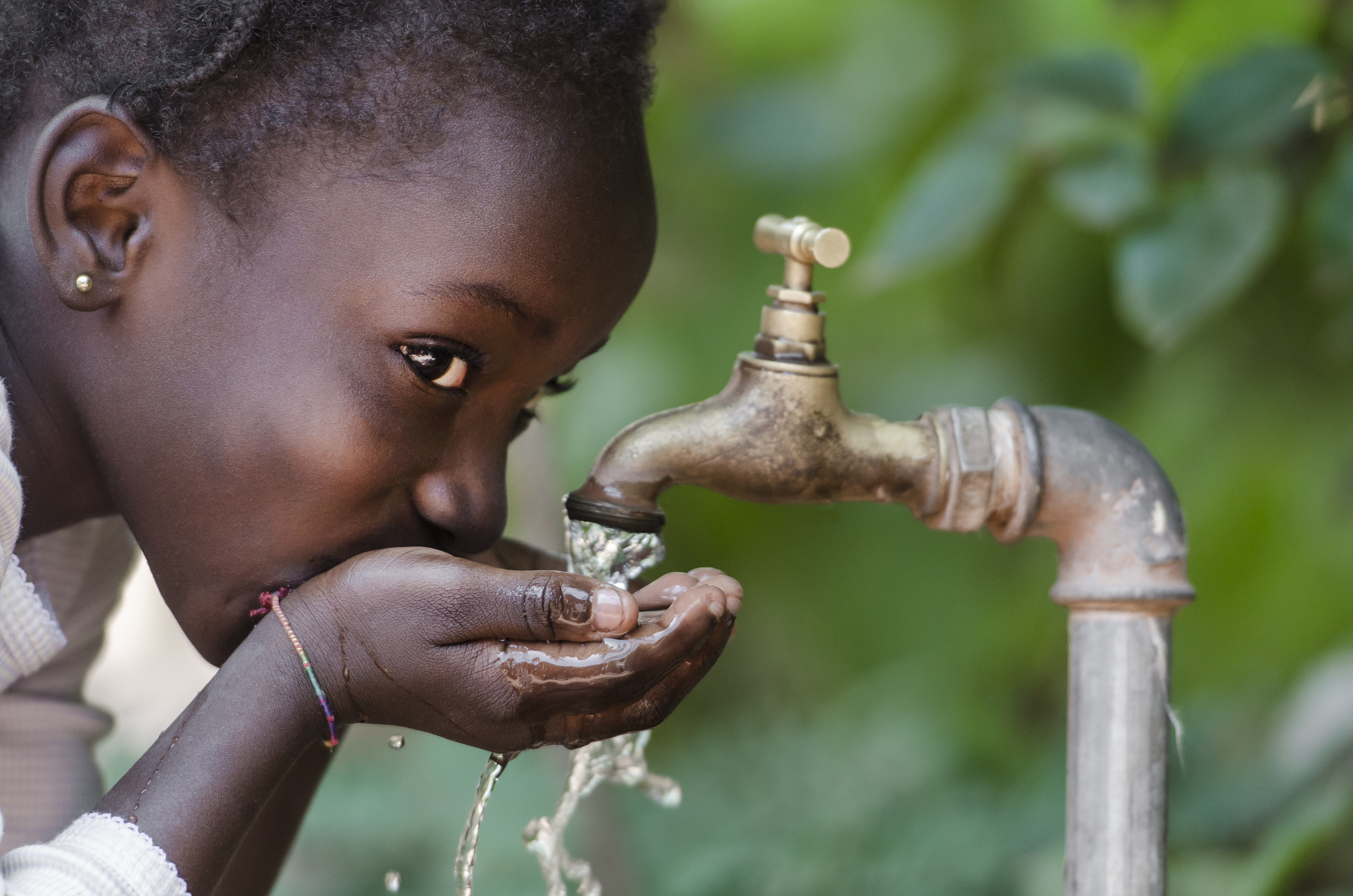 Social Issues: African Black Child Drinking Fresh Water From Tap